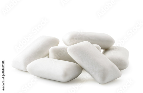 Photos Pile of chewing gum pads close up on a white. Isolated.