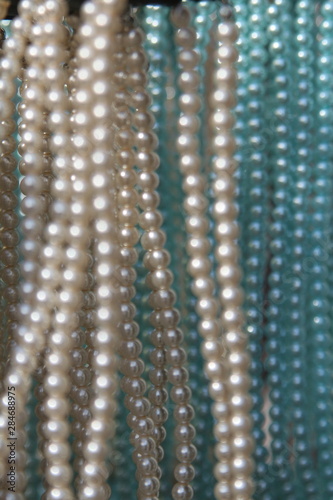 close-up of necklaces with pearls