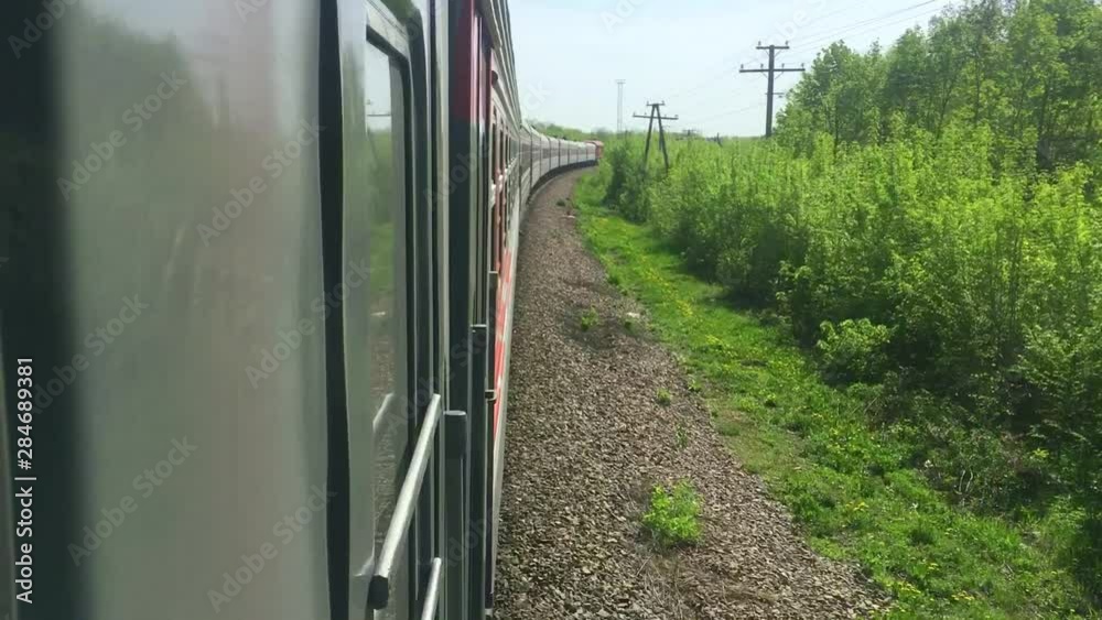railroad travel concept. locomotive train with passenger wagon lifestyle carriages moving by rail in nature beautiful view outside. tourism travel by the rail railroad travel concept. locomotive train with passenger wagon lifestyle carriages moving by rail in nature beautiful view outside. tourism travel by the rail