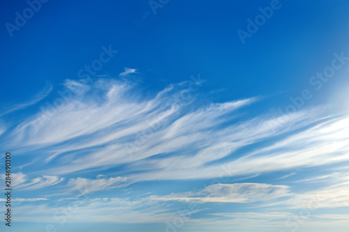beautiful blue sky with soft cirrus clouds for background photo