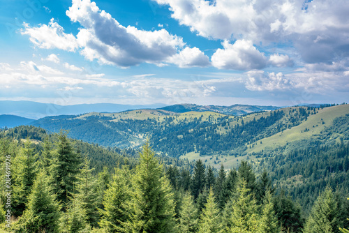 Cloudscape over pine forest in the Carpathian mountains in Transylvania, Romania. © Alpar