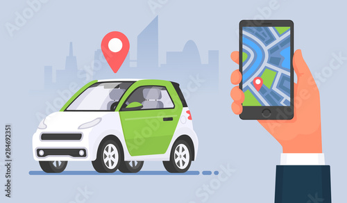 Carsharing. Car rental service using a mobile application. Hand holding smartphone