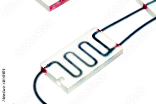 Organ-on-a-chip (OOC) - microfluidic device chip that simulates biological organs that is type of artificial organ. Prototype of design lab-on-a-chip in microfluidic laboratory photo