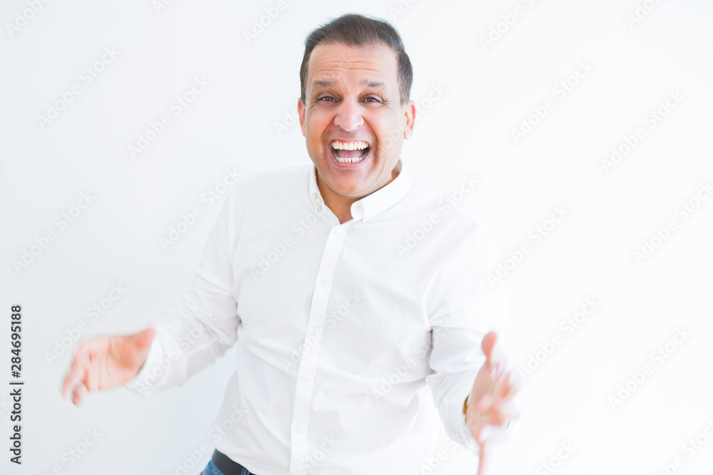 Middle age man celebrating and screaming happy for succesful win Middle age man celebrating and screaming happy for succesful win
