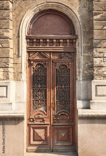 Big vintage wooden door of old building © New Africa