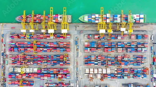 Container ship loading and unloading in deep sea port, Aerial top view of business logistic import and  export freight  transportation by container cargo freight shipping in open sea. photo