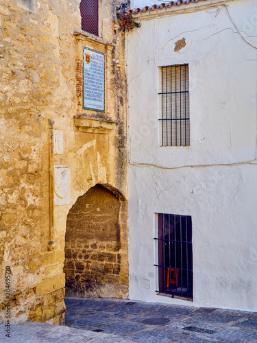 Fototapeta Naklejka Na Ścianę i Meble -  Arch of La Segur, Arco de La Segur, in the Marques de Tamaron street. Vejer de la Frontera downtown. Cadiz province, Andalusia, Spain