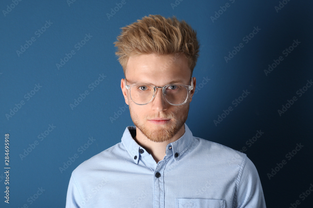 Portrait of handsome young man on blue background Portrait of handsome young man on blue background