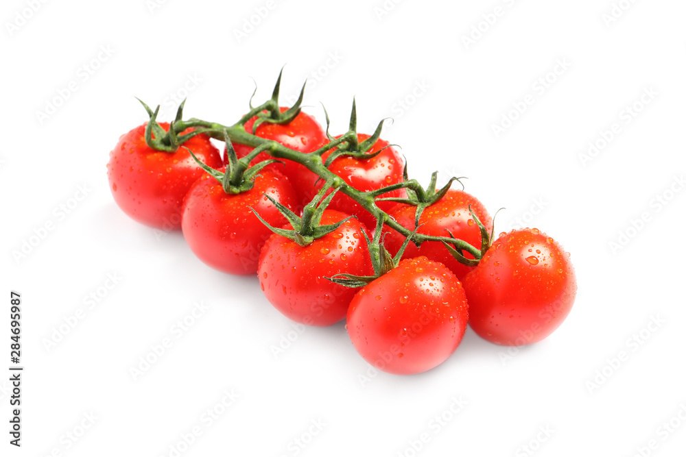 Branch of fresh cherry tomatoes isolated on white Branch of fresh cherry tomatoes isolated on white