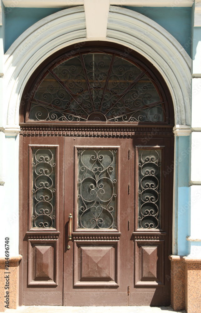 Building with vintage wooden door. Exterior design