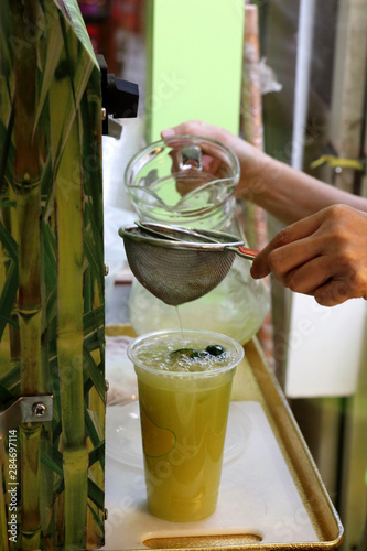 preparation of a sugar cane juice - Kuala Lumpur Malaysia Asia photo