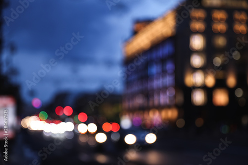 Blurred view of modern city at evening. Bokeh effect © New Africa