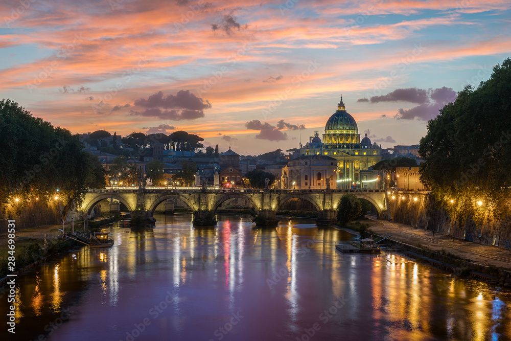 Rome skyline in a summer evening, as seen from Umberto I bridge, with Saint Peter Basilica in the background.