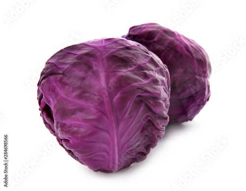Whole ripe red cabbages on white background