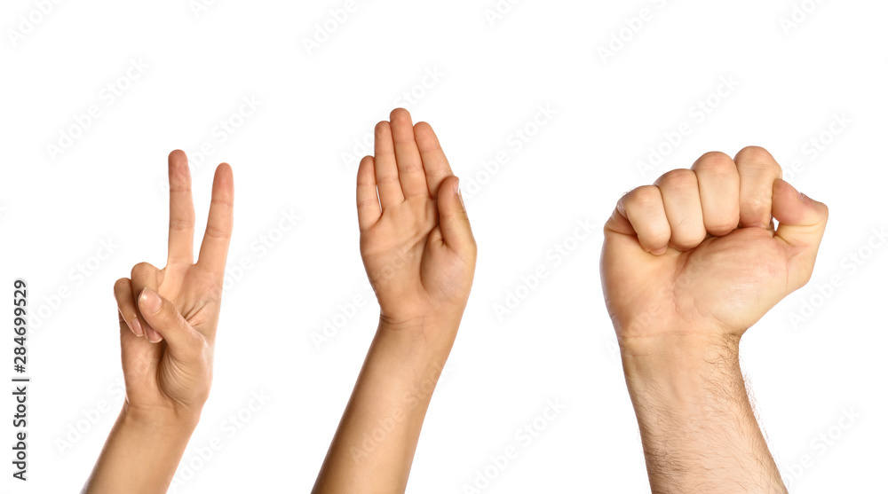 Family playing rock, paper and scissors on white background, closeup Family playing rock, paper and scissors on white background, closeup