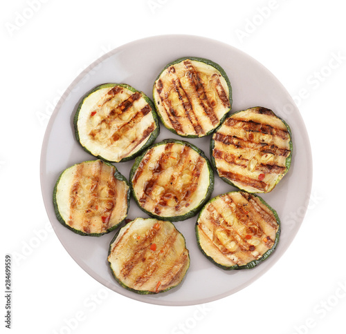 Grilled zucchini slices on white background, top view