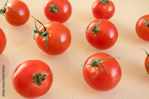 Tomatoes pattern on beige background