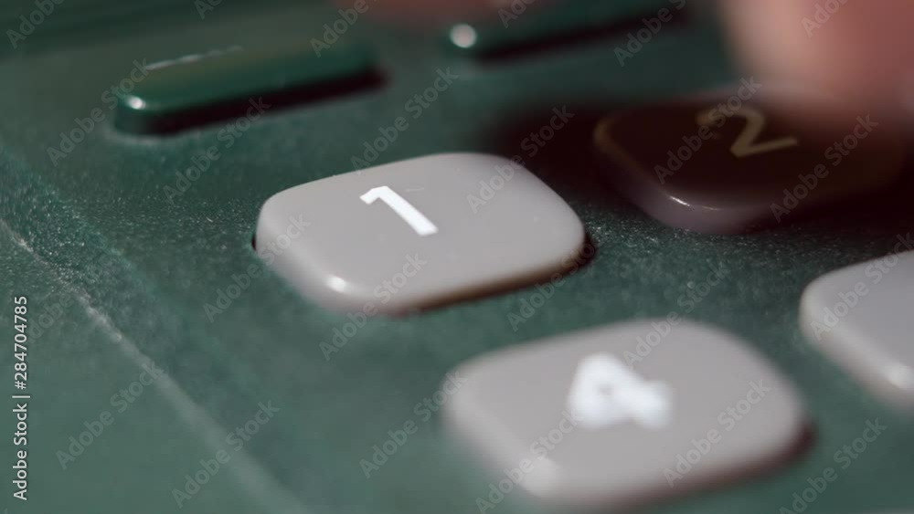 Men's Finger Dials On The Number One Button On The A Wired Phone. Men's Finger Dials On The Number One Button On The A Wired Phone.