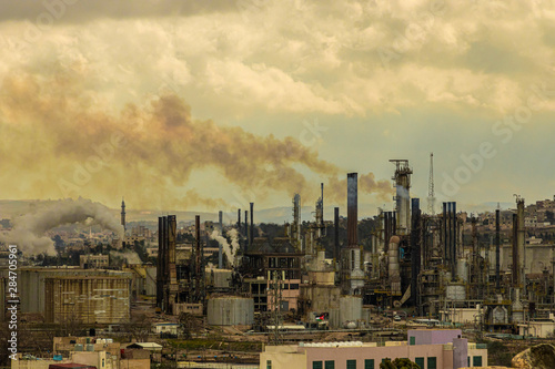 Photos Oil Refinery Industry Emitting Smoke into Polluted Sky