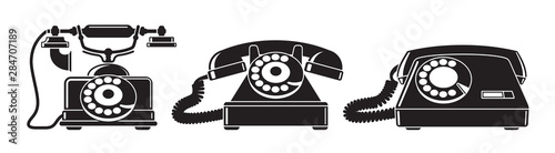Old phones. Set of vintage phones from different periods. Black and white vector illustration