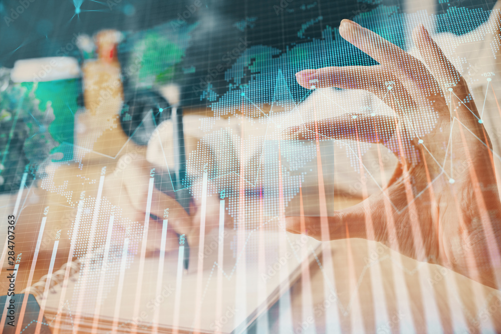 Forex chart displayed on woman's hand taking notes background. Concept of research. Multi exposure Forex chart displayed on woman's hand taking notes background. Concept of research. Multi exposure