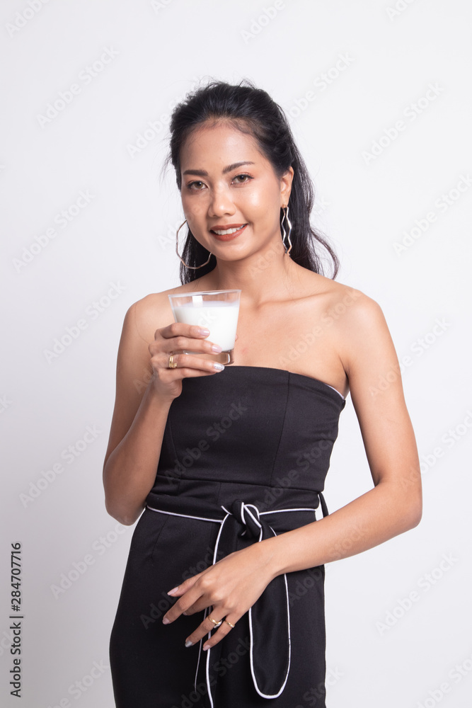 Healthy Asian woman drinking a glass of milk. Healthy Asian woman drinking a glass of milk.