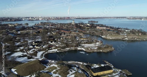 Aerial footage of Suomenlinna Sveaborg fortress and lagoon on Baltic Sea with cannons, submarine and boats in bright spring day near Helsinki. Finland Suomi, Scandinavia photo