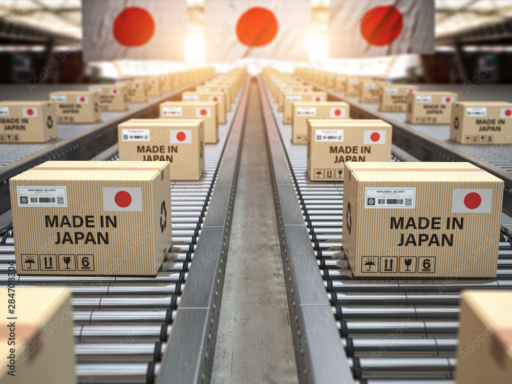 Made in Japan. Cardboard boxes with text made in Japan and chinese flag on the roller conveyor.