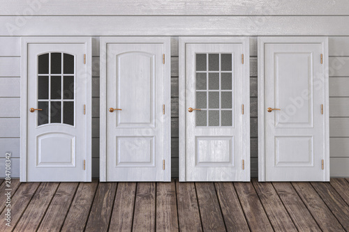 White doors of different types on white wooden background.