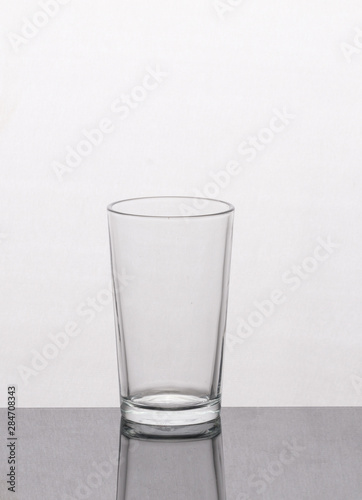 empty glass of water on blue background