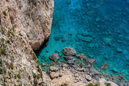 View to the crystal clear blue sea from the cliffs in the southwest of Zakynthos, near Keri