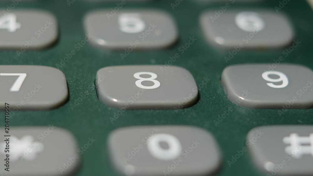 Men's Finger Dials On The Number Eight Button On The A Wired Phone. Men's Finger Dials On The Number Eight Button On The A Wired Phone.