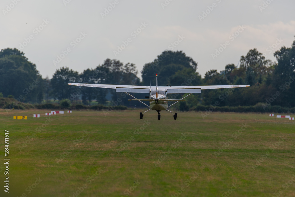 a landing plane on a gray background a landing plane on a gray background