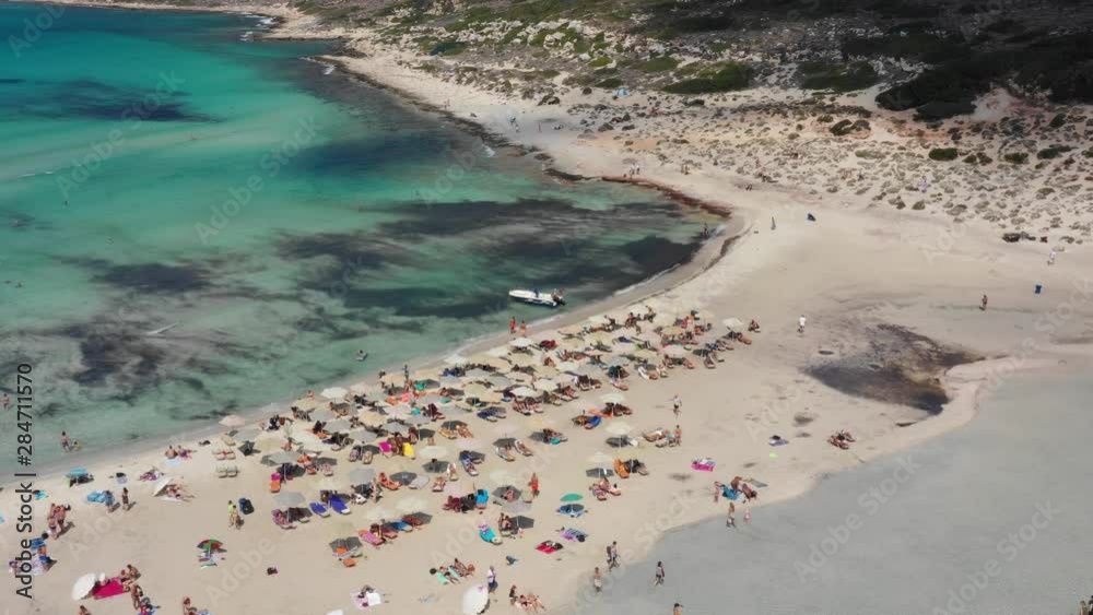 Aerial drone view video of iconic Balos beach and lagoon near Gramvousa island with turquoise clear sea and pure white sand, Crete island, Greece. Balos Beach, Crete, Greece. Aerial drone view video of iconic Balos beach and lagoon near Gramvousa island with turquoise clear sea and pure white sand, Crete island, Greece. Balos Beach, Crete, Greece.