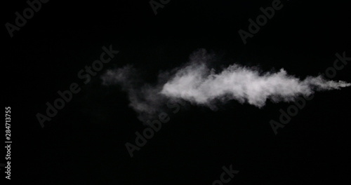 White vapour trail isolated on black background