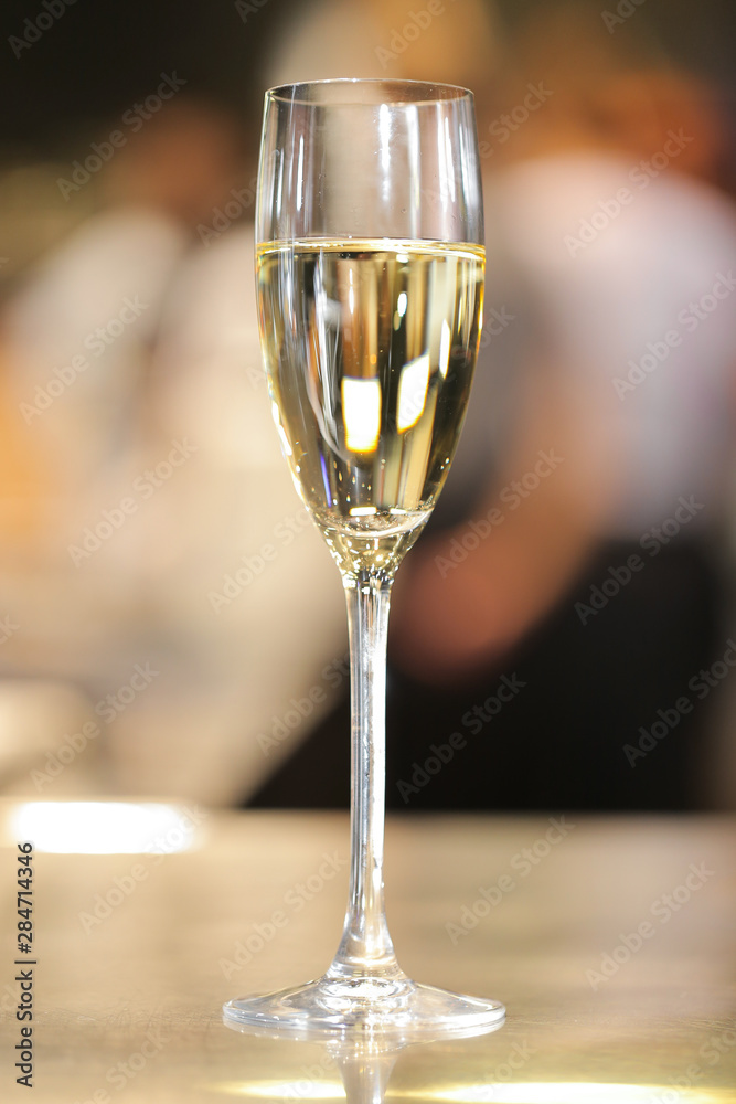 Glass of champagne on table Glass of champagne on table
