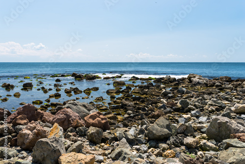 Rocky shore over the beautiful Black Sea, in Nessebar, Bulgaria. In the background a sky with clouds. © Michal