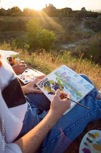 girl painter holds a brush