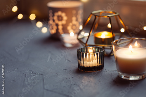 Hygge concept with candles and festive on the windowsill photo