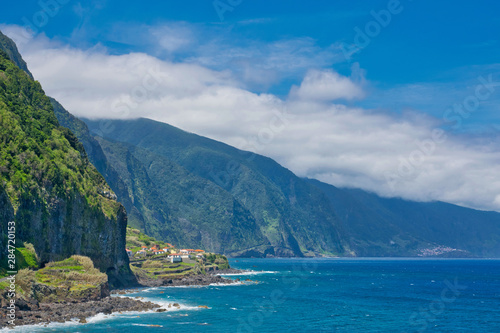 Best panoramic adorable view blue water and blue sky viewpoint on Madeira island in Atlantic ocean view from Sao Vicente and Ponta Delgada to Porto Moniz in summer sunny day, Madeira island, Portugal 