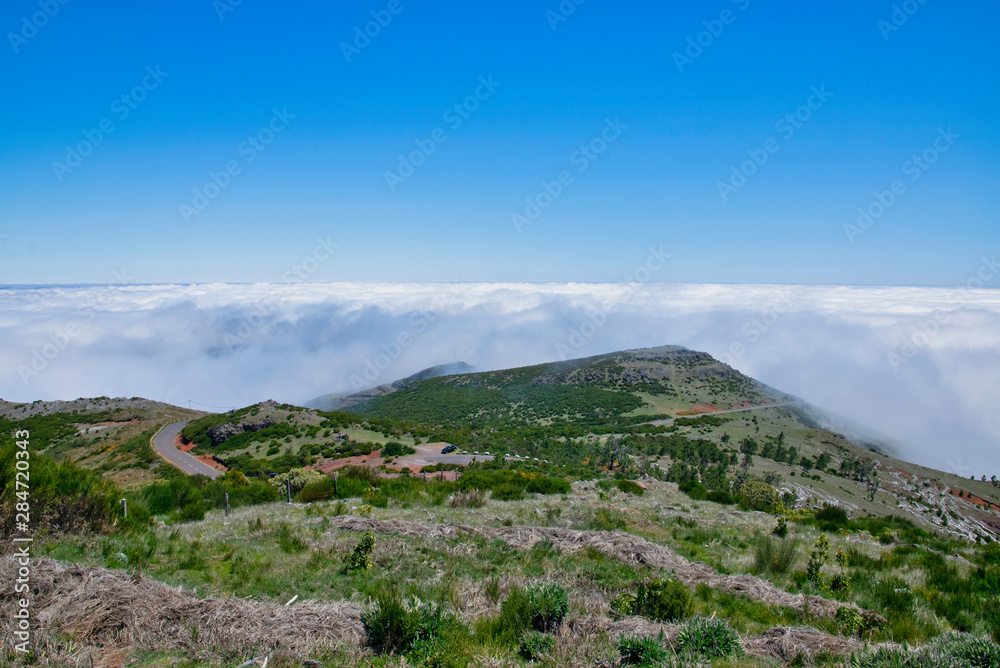 Landscape of hiking trail from Pico do Arieiro to Pico Ruivo, Madeira island, Portugal in summy summer day above the clouds