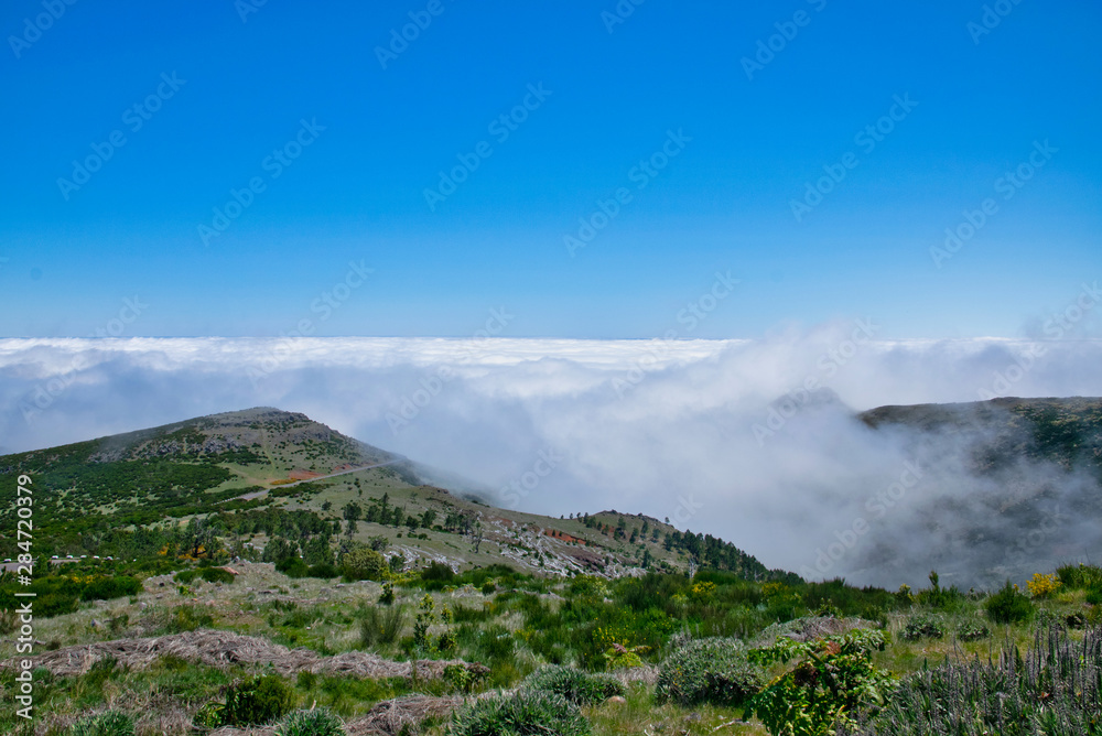 Landscape of hiking trail from Pico do Arieiro to Pico Ruivo, Madeira island, Portugal in summy summer day above the clouds
