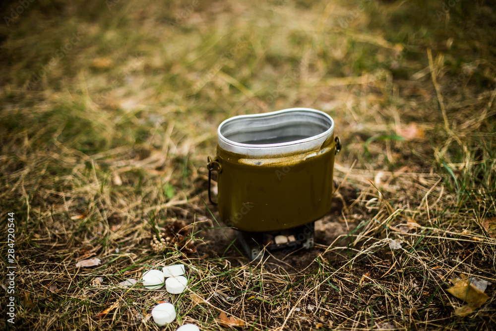 Water kettle on a camping / tourist stove Water kettle on a camping / tourist stove