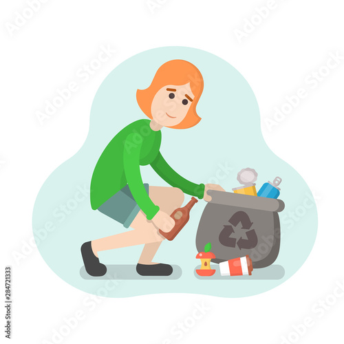 Woman collects trash in a bag