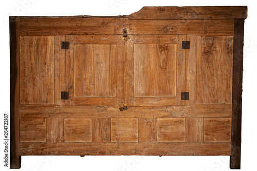 An old wooden broken chest of drawers from an abandoned place.