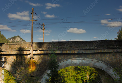 Semmeringbahn Übeführung Bogen Viadukt blauer Himmel mit Wolken photo