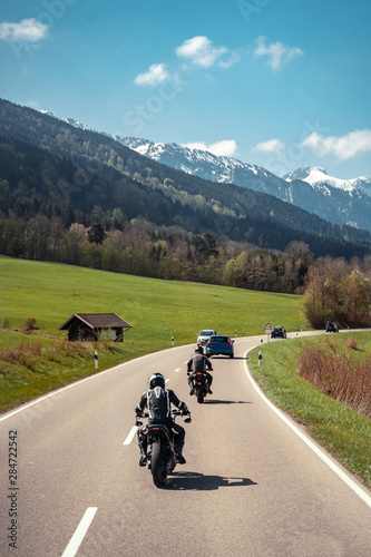 Two biker riding alone on mountainous road © teksomolika