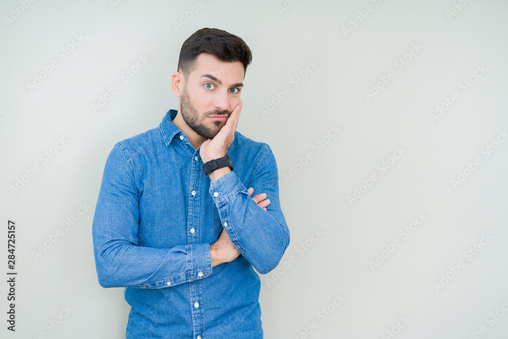 Young handsome man over isolated background thinking looking tired and bored with depression problems with crossed arms. Young handsome man over isolated background thinking looking tired and bored with depression problems with crossed arms.