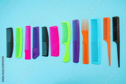 Plastic combs isolated on blue background