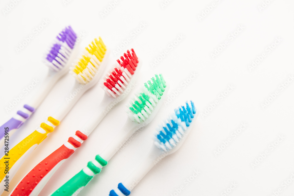 set of plastic toothbrushes on white background set of plastic toothbrushes on white background